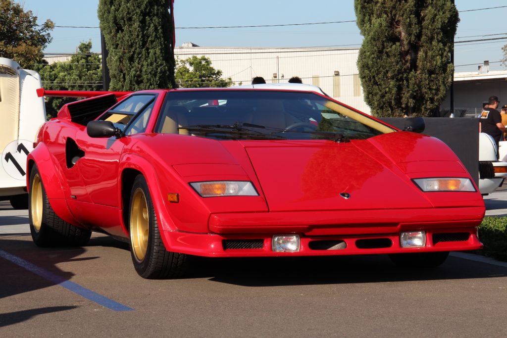 1988 Lamborghini Countach 5000QV in red color with gold wheels, front 3/4