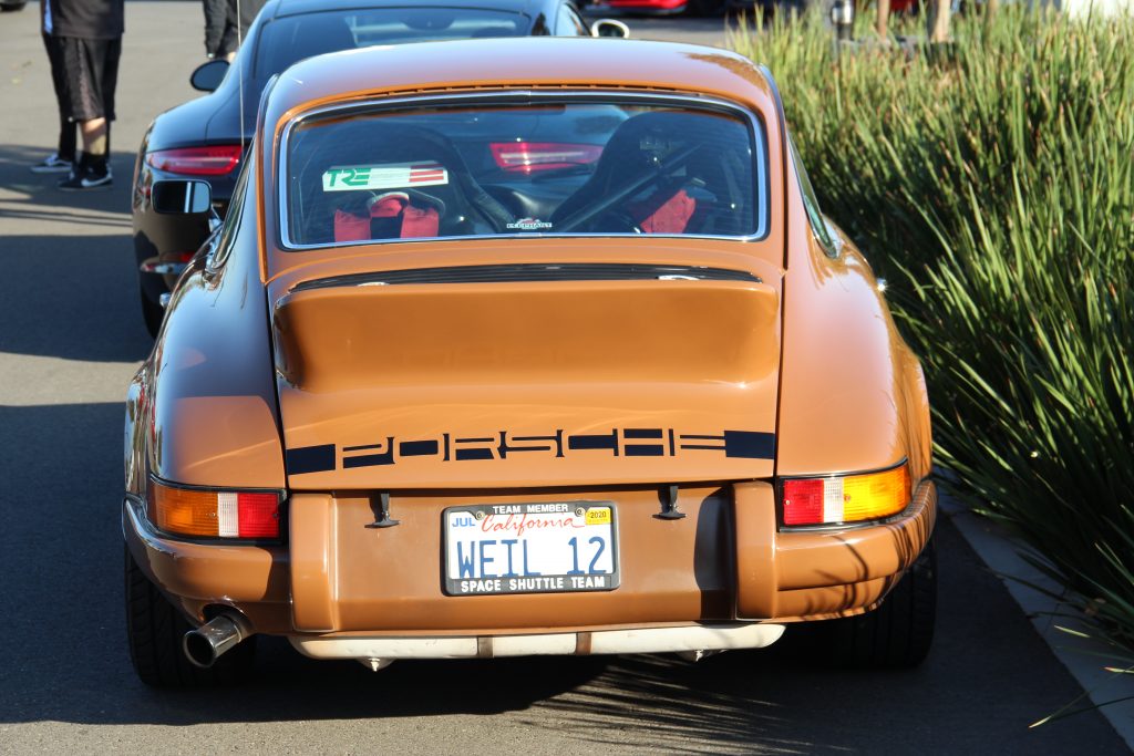 Porsche 911 classic brown color rear with racing seats and harnesses