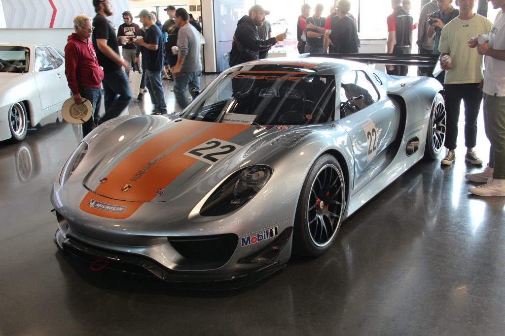 Porsche 918 racing car in silver inside Porsche Experience Center Los Angeles