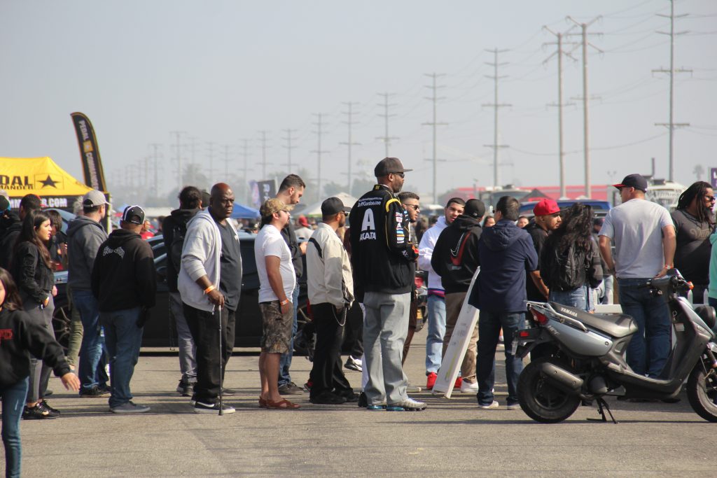 Fans at car show wait in line to buy food and drinks