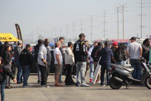 Fans wait in line for concessions at a car show