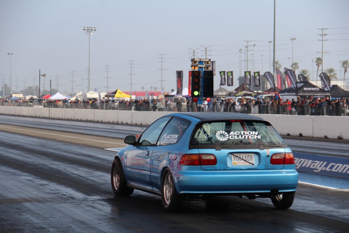Honda Civic hatchback EG, teal, with drag racing slicks, prepares to do a 1/4 mile run