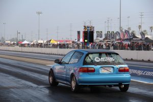 Honda Civic hatchback EG, teal, with drag racing slicks, prepares to do a 1/4 mile run