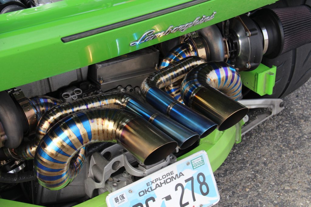 The custom titanium exhaust system of a twin turbocharged Lamborghini Huracan