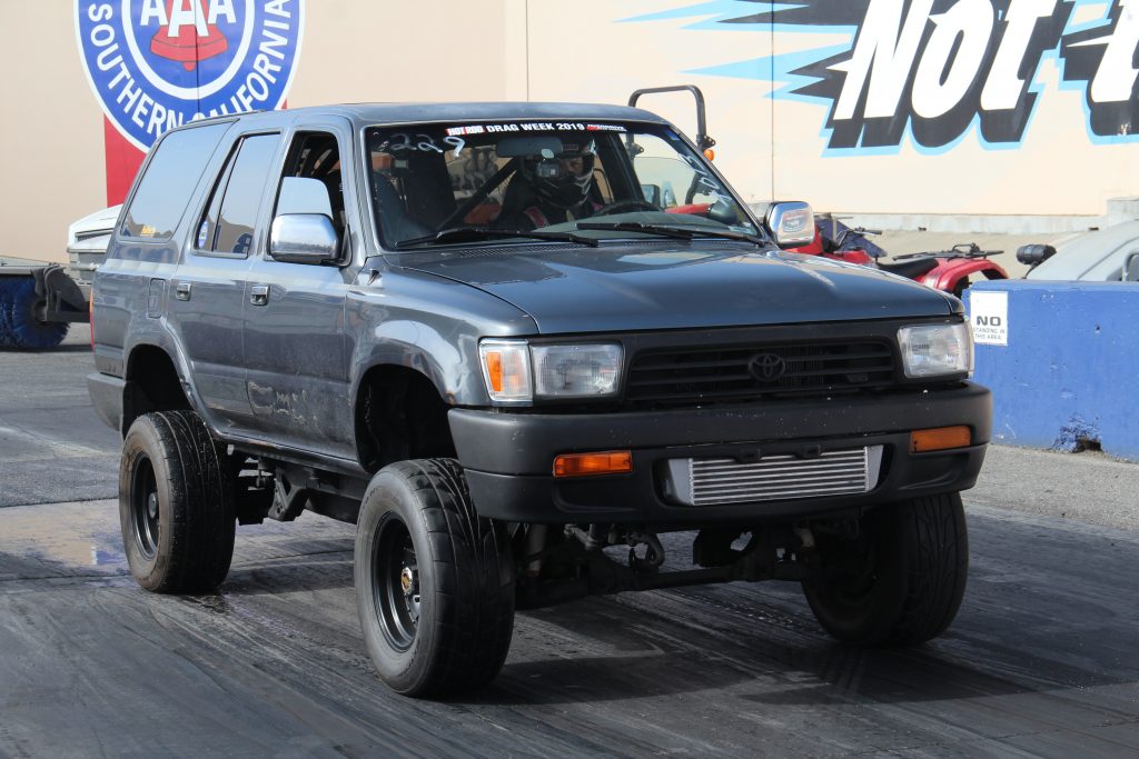 An older Toyota 4Runner, lifted, with front mount intercooler, prepares to do a 1/4 mile pass