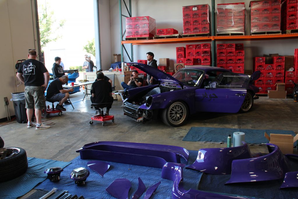 Allen Yang's purple Porsche 964 sitting inside a warehouse, waiting to be built.