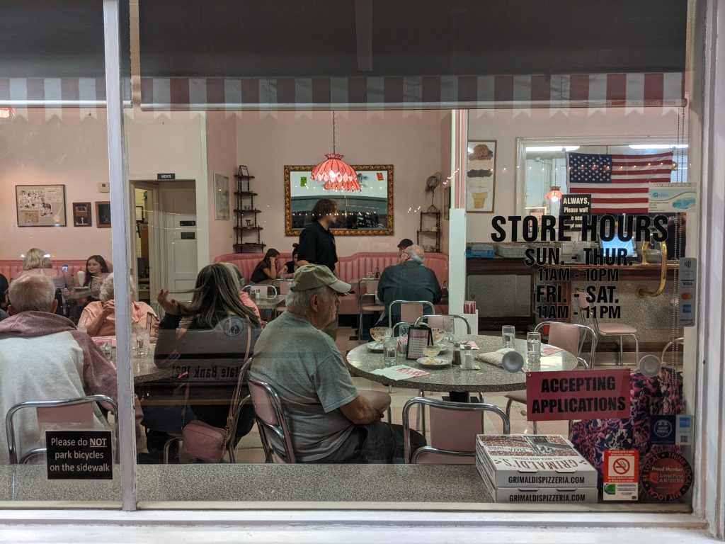 Photo taken through the window looking inside Sugar Bowl, an ice cream shop in the historic part of Scottsdale, Arizona